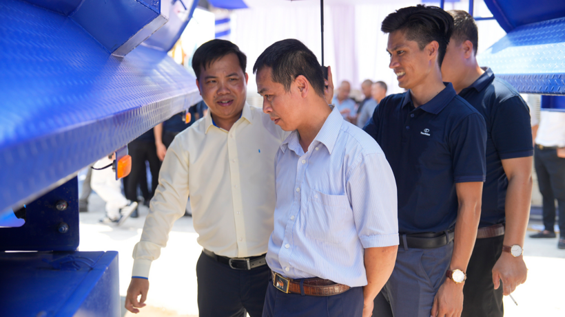 Attendees exploring and discussing Thaco Trailers’ products.