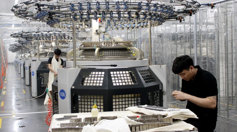 Workers produce textile products serving the garment industry at the Hai Ha Industrial Park in Quang Ninh province.