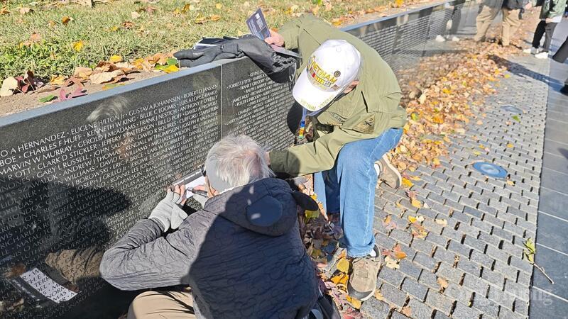 Rubbing a loved one’s name from the wall onto paper as a keepsake.