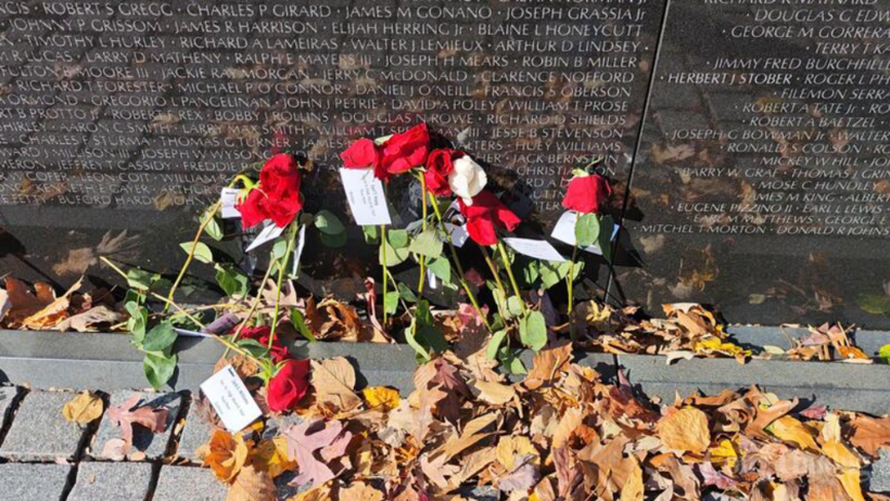 Roses and golden autumn leaves.