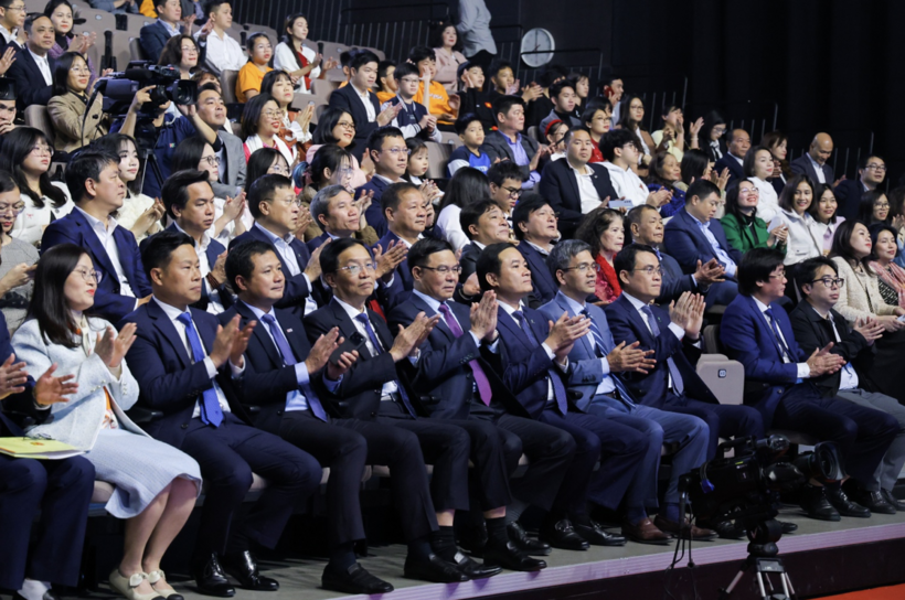 Delegates attend the program at the Hanoi venue.