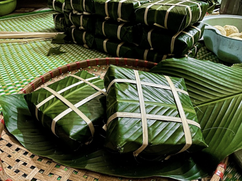 Banh chung, a traditional Vietnamese square sticky rice cake made of glutinous rice, mung beans and pork, wrapped in banana leaves.