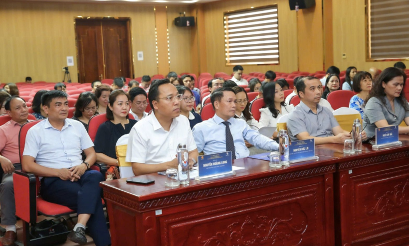 Delegates attend the event