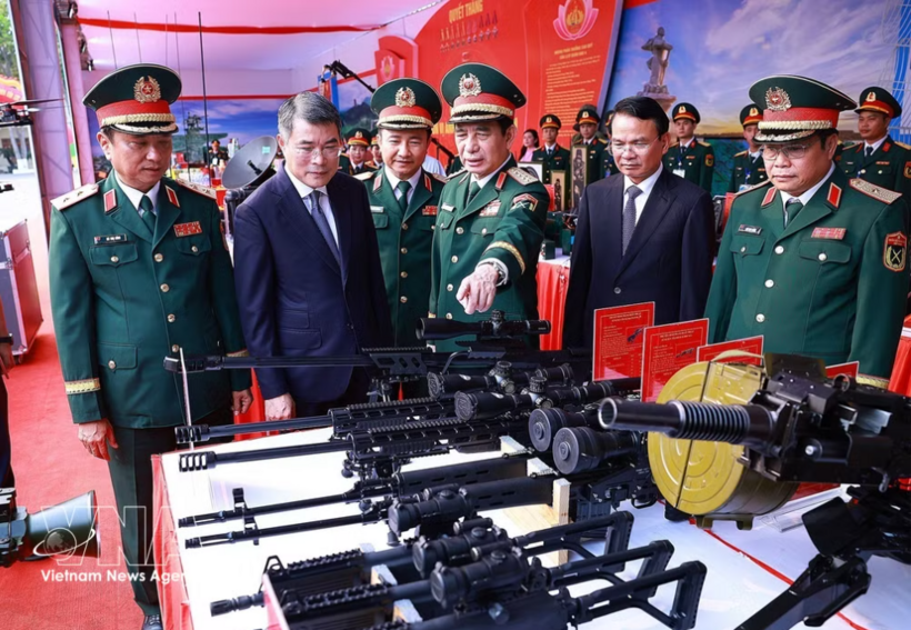 Prime Minister Le Minh Hung and officials visit an exhibition showcasing technical innovations by Military Region 4 at the ceremony on April 18. Photo: VNA