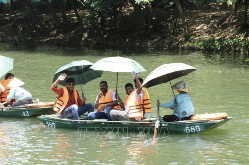 The first visitors in a group of 4,500 guests led by an Indian billionaire during a tour of the Trang An Ecotourism Complex in Ninh Binh. Photo: VNA