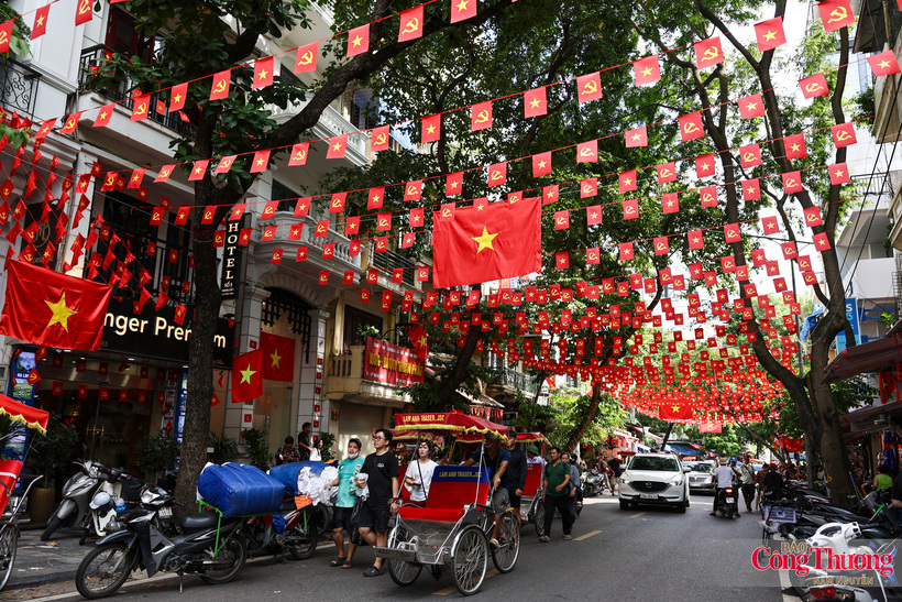 Vibrant national flags fill Hanoi's streets with color during the autumn season.