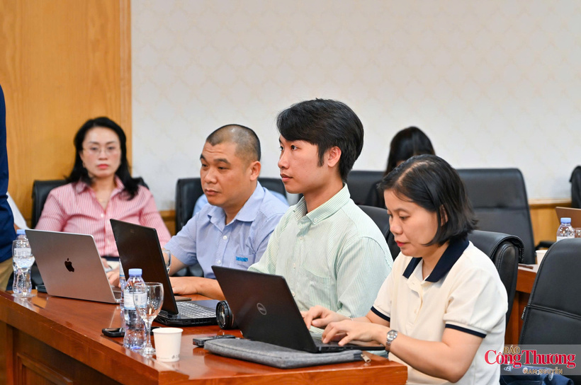 Journalists attend the press conference.