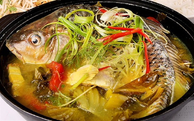 Braised pickled carp or 'cá chép om dưa' is an attractive dish. — Photo eva.vn Braised pickled carp or 'cá chép om dưa' is an attractive dish. — Photo eva.vn