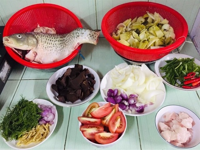 Ingredients include carp, pickles, tomato, fresh herbs, chilli and others. — Photo tastykitchen.vn Ingredients include carp, pickles, tomato, fresh herbs, chilli and others. — Photo tastykitchen.vn