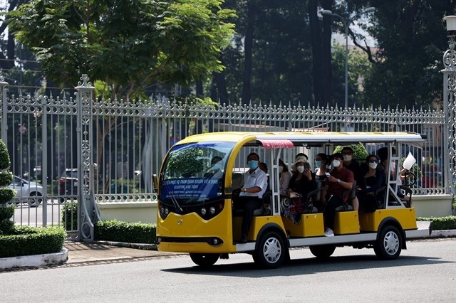 An electric car carries visitors in District 1, HCM City. — VNA/VNS Photo Hồng Đạt