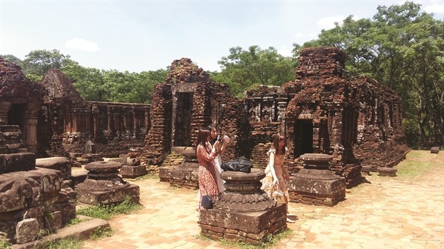 ANCIENT: Tourists visit a tower of the Mỹ Sơn Sanctuary in Quảng Nam Province. The UNESCO-recognised world heritage site is one of the most visited sites in the province. ANCIENT: Tourists visit a tower of the Mỹ Sơn Sanctuary in Quảng Nam Province. The UNESCO-recognised world heritage site is one of the most visited sites in the province.