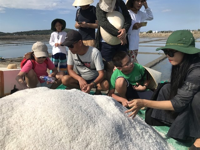 FEELING SALTY: School students join a trip to the Sa Huỳnh salt fields in Quảng Ngãi Province's Đức Phổ town. The centre of salt production offers tourism and education as two key factors for sustainable development. — Photo courtesy of SAHU FEELING SALTY: School students join a trip to the Sa Huỳnh salt fields in Quảng Ngãi Province's Đức Phổ town. The centre of salt production offers tourism and education as two key factors for sustainable development. — Photo courtesy of SAHU