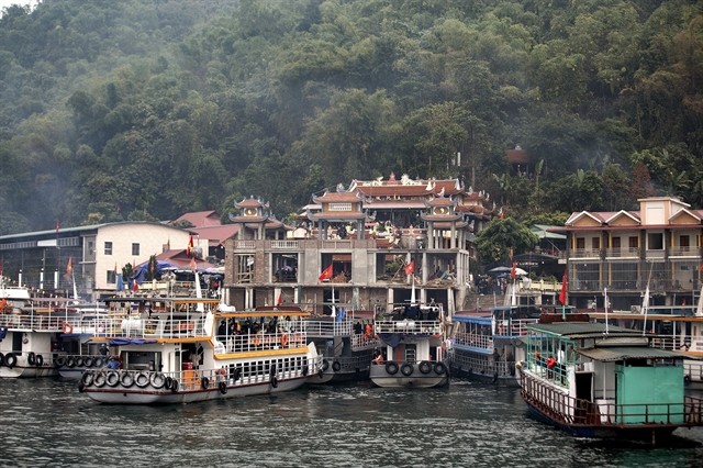Tourist boats dock at a wharf in front of the Temple of Thác Bờ Goddess by Hòa Bình Lake. — VNA/VNS Photo Trọng Đạt Tourist boats dock at a wharf in front of the Temple of Thác Bờ Goddess by Hòa Bình Lake. — VNA/VNS Photo Trọng Đạt