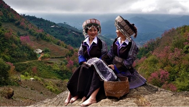 The motifs on the traditional costumes of Mông ethnic women are batik, a resist dye technique using beeswax. — Photo vov.vn The motifs on the traditional costumes of Mông ethnic women are batik, a resist dye technique using beeswax. — Photo vov.vn