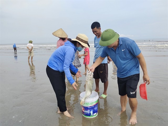 Visitors are happy with their catch. Visitors are happy with their catch.