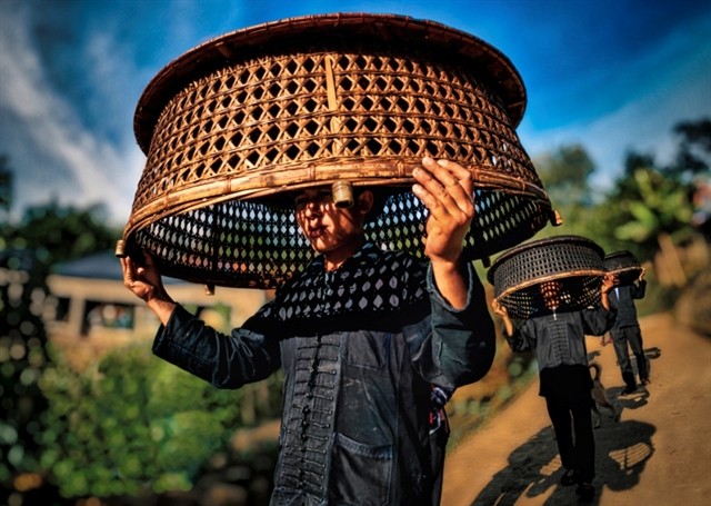 A photo in the 2023 winning photo collection of Nguyễn Vũ Hậu depicting the Khù Già Già Festival of Hà Nhì ethnic people in the northern province of Lào Cai. — Photo courtesy of Heritage magazine A photo in the 2023 winning photo collection of Nguyễn Vũ Hậu depicting the Khù Già Già Festival of Hà Nhì ethnic people in the northern province of Lào Cai. — Photo courtesy of Heritage magazine