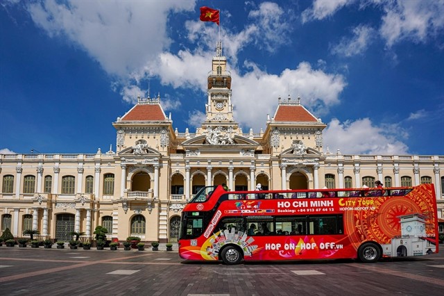 Hop-on hop-off city sightseeing tour is a famous activity in HMC City. -- Photo halotravel.vn