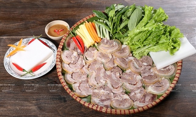Boiled calf meat arranged on a bamboo dish becomes one of Tây Ninh Province's specialties. — Photo vietnam.vnanet.vn