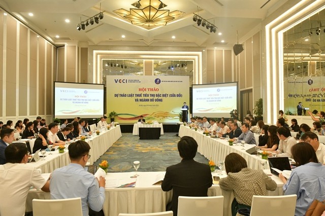 Participants attend a workshop to collect experts’ opinions for the draft of the amended Special Consumption Tax Law and the beverage industry in Hà Nội on August 8. — Photo baotintuc.vn