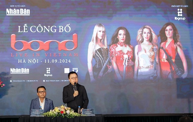 Editor-in-Chief of Nhân Dân (People) newspaper and Deputy Head of the Central Committee's Publicity and Education Commission Lê Quốc Minh (right) and Chairman of IB Group Vietnam and Production Director of the concert, Nguyễn Thùy Dương, seen at a press conference about the concert ‘BOND Live in Vietnam’. — Photo courtesy of Nhân Dân (People) newspaper Editor-in-Chief of Nhân Dân (People) newspaper and Deputy Head of the Central Committee's Publicity and Education Commission Lê Quốc Minh (right) and Chairman of IB Group Vietnam and Production Director of the concert, Nguyễn Thùy Dương, seen at a press conference about the concert ‘BOND Live in Vietnam’. — Photo courtesy of Nhân Dân (People) newspaper