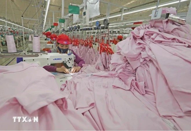 Workers at Tinh Loi Garment Company in the northern province of Hai Duong make products for export. (Photo: VNA Workers at Tinh Loi Garment Company in the northern province of Hai Duong make products for export. (Photo: VNA