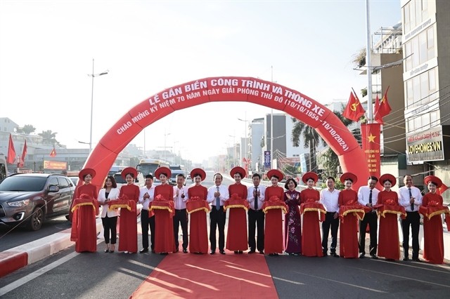 The city's leaders cut the ribbons to open the route. 