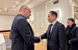 Party official works with National Secretary of French Socialist Party for International Relations