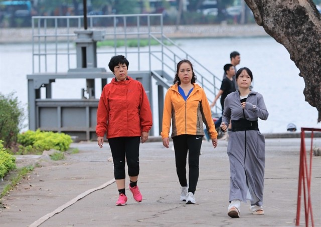 Local people wear light jackets when doing exercises in Thống Nhất Park in Hà Nội on Monday morning. — VNA/VNS Photo Hoàng Hiếu