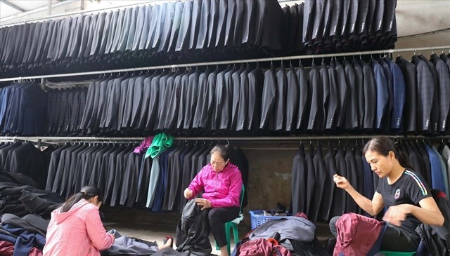 Vân Từ villagers make suits that are famed nationwide. — Photo courtesy of Phú Xuyên People's Committee