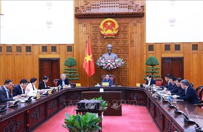 Prime Minister Pham Minh Chinh chairs the sixth meeting on rearranging and streamlining the Government's apparatus. (Photo: VNA)